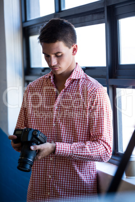 Man checking photo in camera