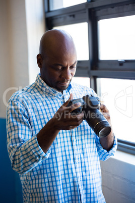 Man checking photo in camera