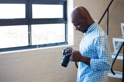 Man checking photo in camera