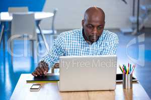 Man working on his graphics tablet