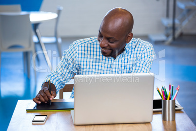 Man working on his graphics tablet