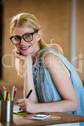 Creative woman drawing on a graphic tablet