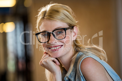 Beautiful woman in spectacle with hand on chin