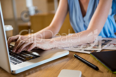 Woman using laptop in office