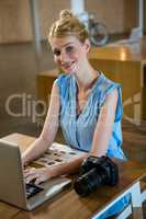 Woman using laptop in office