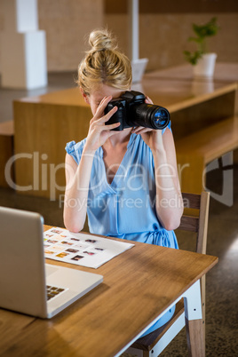 Woman clicking photo from camera