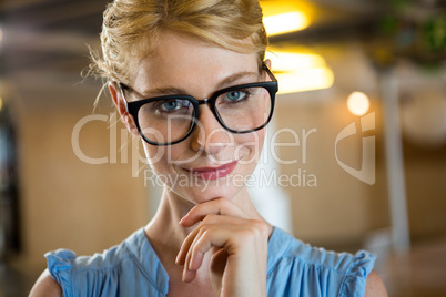 Beautiful woman in spectacle with hand on chin