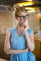 Beautiful woman in spectacle with hand on chin