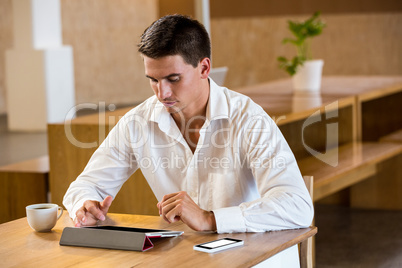 Man using digital tablet in office