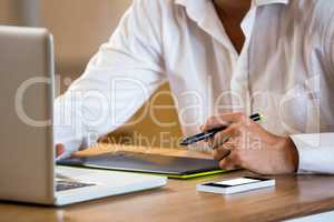 Man working on his graphics tablet