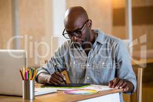 Man working on his graphics tablet