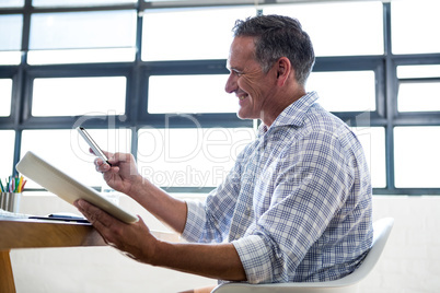 Man with digital tablet and mobile phone