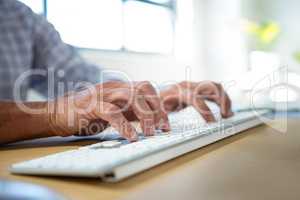 Man typing on keyboard