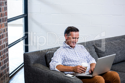 Man using laptop in office