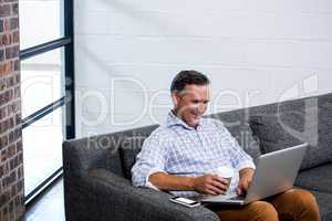 Man using laptop in office