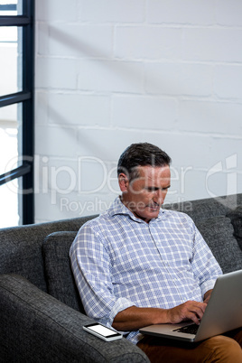 Man using laptop in office