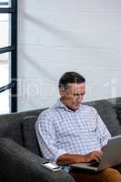 Man using laptop in office