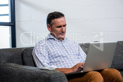 Man using laptop in office