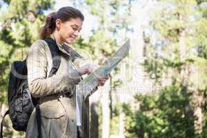 Smiling woman checking the map