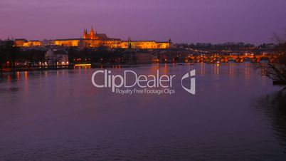 Wide Static Shot of the Vltava River and Prague Castle at Dusk