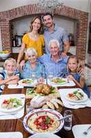 Portrait of multi-generation family having meal