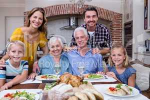 Portrait of multi-generation family having meal