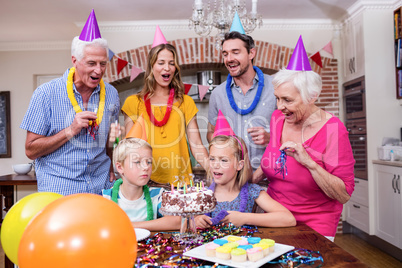 Multi-generation family having fun at birthday party