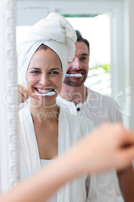 Couple brushing their teeth in the bathroom