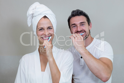 Couple brushing their teeth in the bathroom