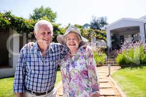 Senior couple embracing in the garden