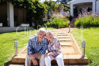 Senior couple embracing in the garden