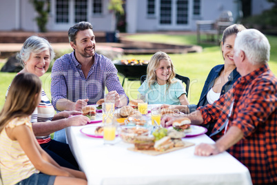 Happy family having lunch in the garden