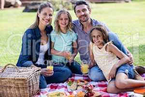 Portrait of happy family having a picnic