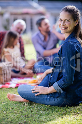 Happy woman having a picnic with her family