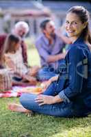 Happy woman having a picnic with her family