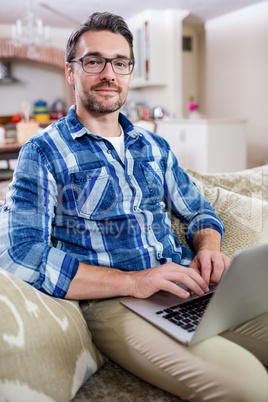 Portrait of man using a laptop