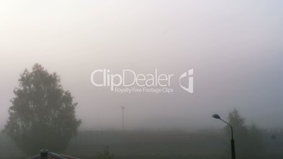 Foggy sunrise at a train station time lapse 4k