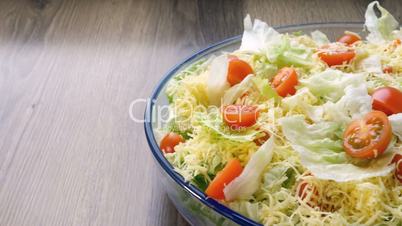 Beautiful colourful caesar salad with dressing croutons and parmesan cheese, healthy meal