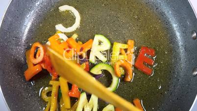 Stir-frying mixed alphabet letters vegetables