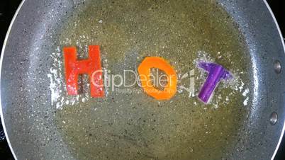 Stir-frying mixed alphabet letters, word Hot