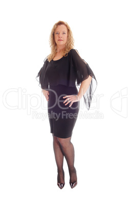 Blond  middle age woman in black dress.