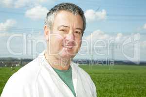 Portrait of farmer in front of his box