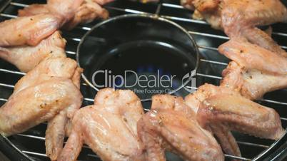 Frying chicken wings on a gas grill