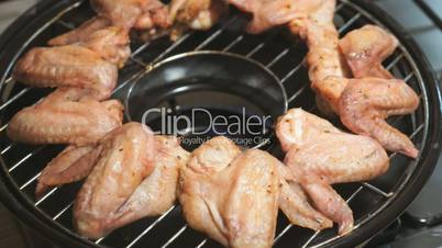Frying chicken wings on a gas grill