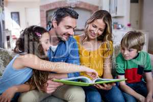 Happy family looking at a photo album