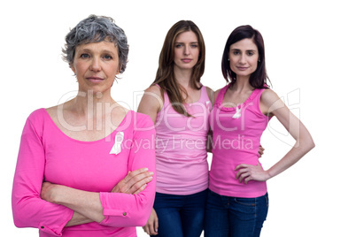 Women in pink outfits posing for breast cancer awareness