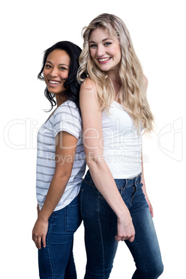 Portrait of beautiful women standing back to back