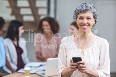 Portrait of businesswoman using mobile phone