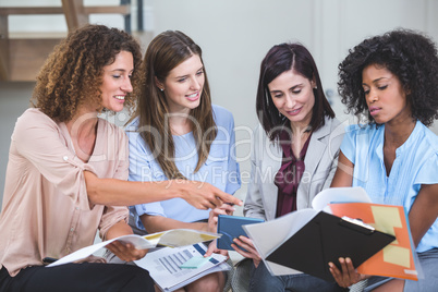 Female business colleagues interacting with each other