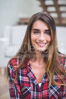 Beautiful woman smiling in living room